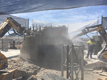 Demolition units working around platform